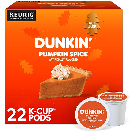 Dunkin' Pumpkin Spice flavored K-Cup pods box by Keurig, showing an orange package with a slice of pumpkin pie, fall leaves, and two individual pods in the foreground.
