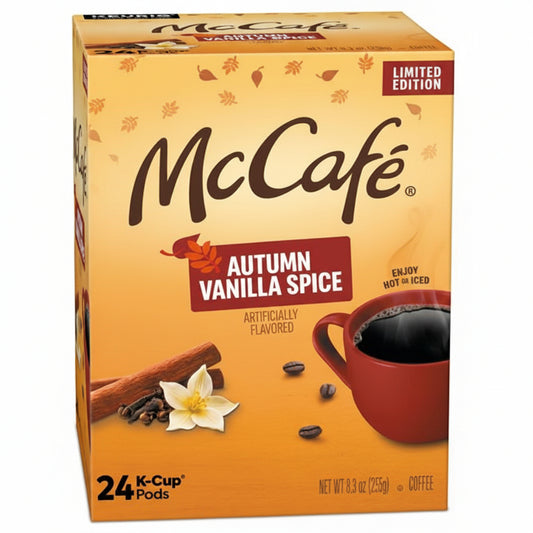 A box of McCafé Autumn Vanilla Spice K-Cup pods, featuring a warm orange and yellow design with illustrations of cinnamon sticks, coffee beans, a red coffee cup, and a vanilla flower. The packaging indicates it contains 24 K-Cups and is a limited edition.