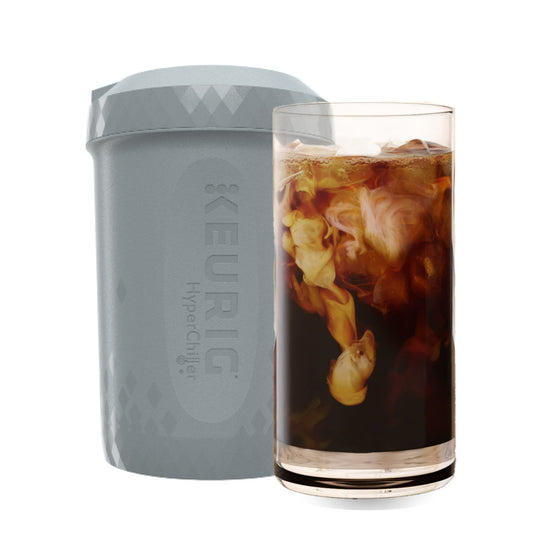 Keurig HyperChill container next to a glass of iced coffee on a white background