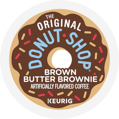 A circular coffee pod label for The Original Donut Shop Brown Butter Brownie, featuring a stylized brown donut with blue lettering, white text, and sprinkles on a white background. Keurig branding is visible at the bottom.